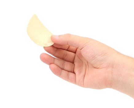 Hand holds potato chips. Isolated on a white background.