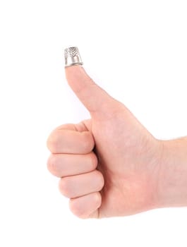 Sewing thimble on a finger of man hand. Isolated on a white background.