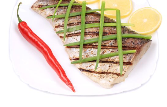 Grilled fish with lemon. Isolated on a white background.
