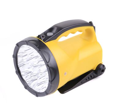 Yellow flashlight. Isolated on a white background.