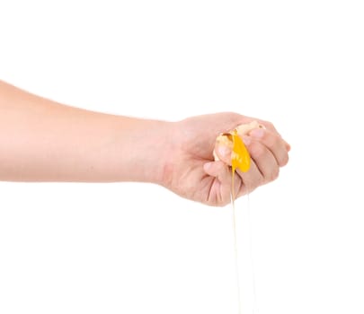 Hand smash egg yolk. isolated on a white background