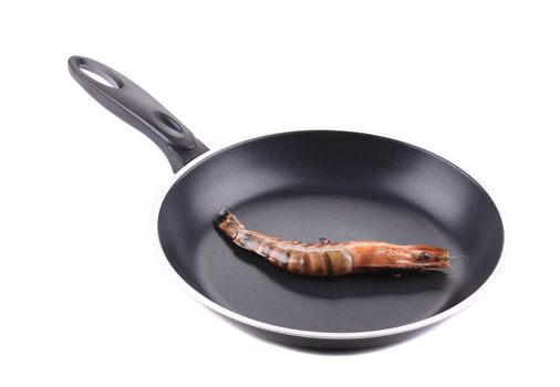 Raw tiger shrimp on frying pan. Isolated on a white background.