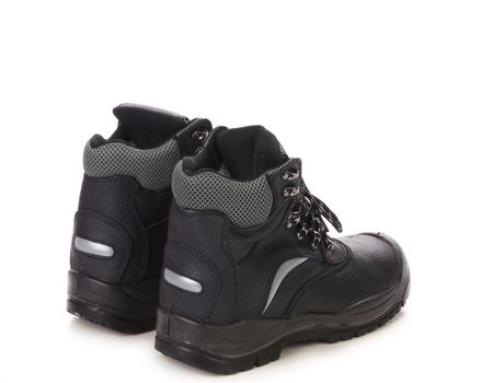 Close up of black shoes with gray spot. Isolated on a white background.