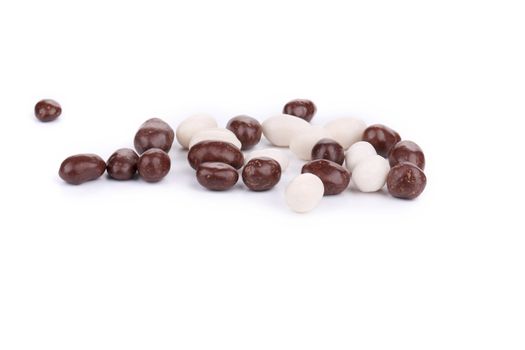 Chocolate covered dragees. Isolated on a white background.