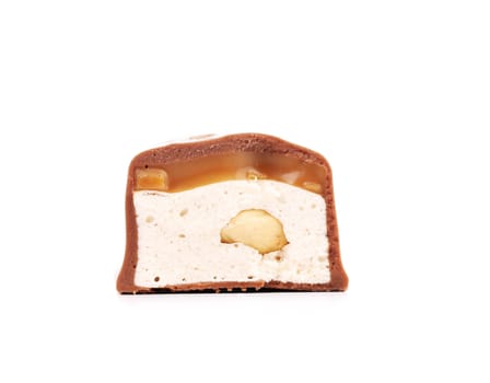 Slices bar of chocolate with peanuts. Isolated on a white background.