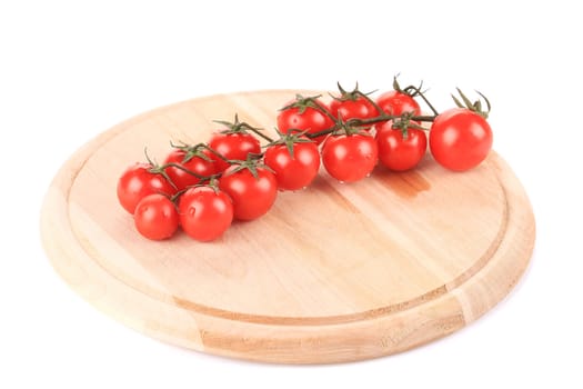 Cluster of Tomatoes on wooden platter. Isolated on a white background.