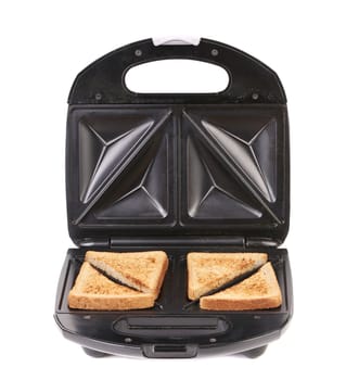 Sandwich toaster with bread slices. Isolated on a white background.