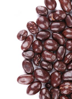 Closeup of chocolate dragee. Isolated on a white background.