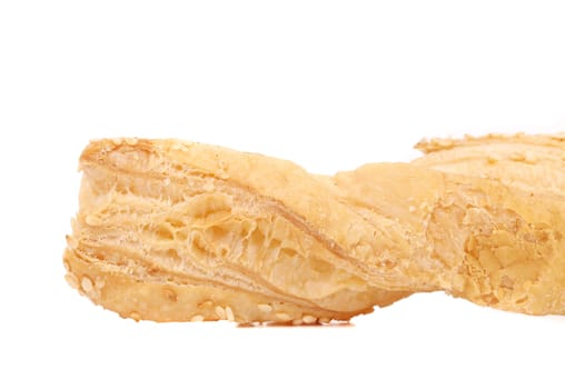 Cheese stick cracker with sesame seeds. Isolated on a white background.