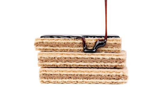 Coated stake wafers of chocolate. Isolated on a white background.