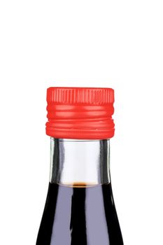 Balsamic vinegar bottle closeup. Isolated on a white background.