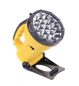 Yellow flashlight. Isolated on a white background.