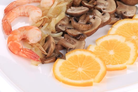 Shrimp salad with lemons and mushrooms. Isolated on a white background.