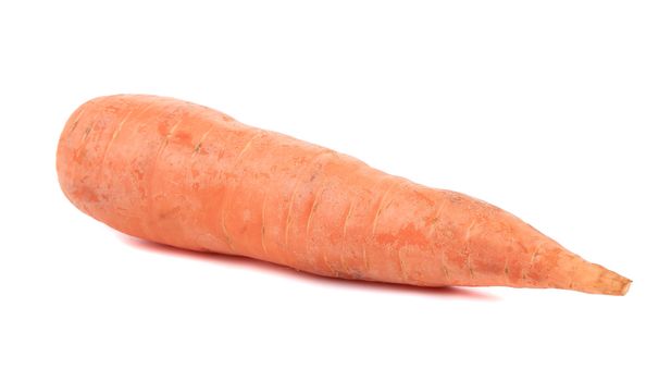 Unpeleed fresh carrot. Isolated on a white background.