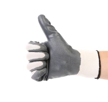 Hand with white fabric glove showing thumb up. Isolated on a white background.