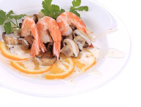 Shrimp salad with mushrooms and white sauce. Isolated on a white background.