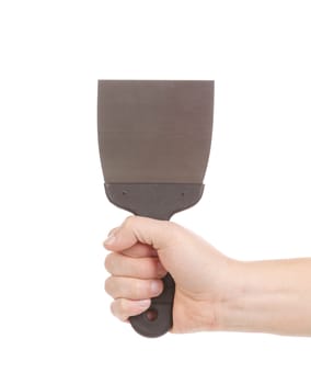 Hand holds metal spatula. Isolated on a white background.