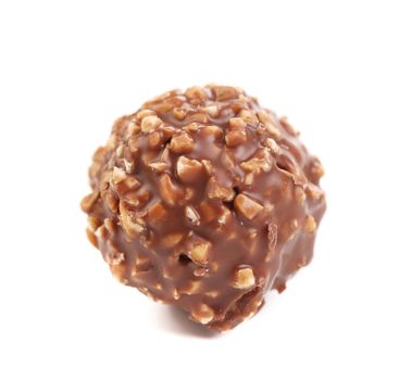 Sweet chocolate ball filled with hazelnuts. Isolated on a white background.