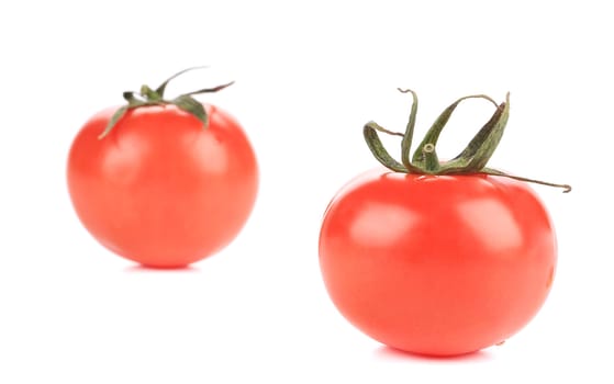 Two fresh tomatoes. Isolated on a white background.