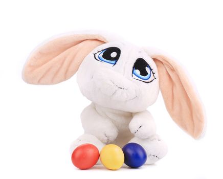 Easter rabbit and colourful eggs. Isolated on a white background.