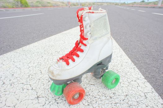 Hdr Picture of Old Vintage White Skate Boot on the Asphalt Sterret