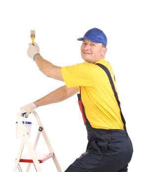 Worker on ladder with paintbrush. Isolated on a white background.