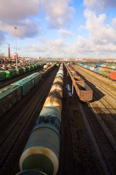 Freight train with color cargo containers in depot