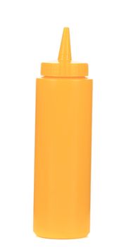 Mustard plastic bottle. Isolated on a white background.