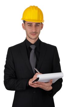 Young man wearing a hard hat and holding a clipboard.