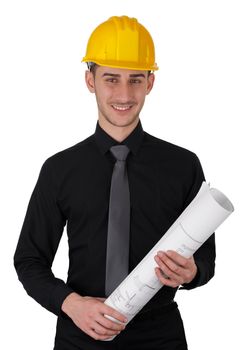 Young man wearing a hard hat and holding a roll of blueprints