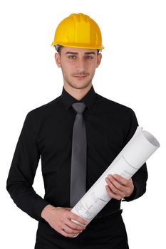 Young man wearing a hard hat and holding a roll of blueprints