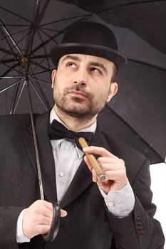 man with bowler hat, cigar and  umbrella 