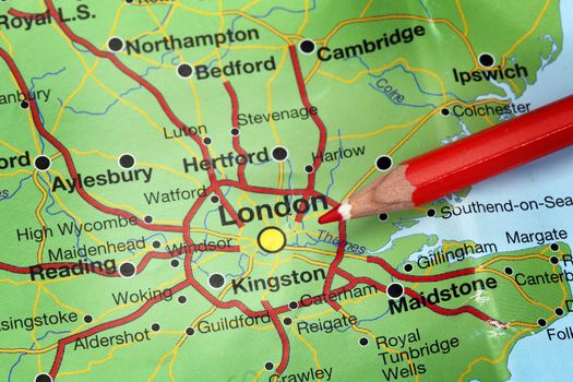 Red pencil  on the map pointing London