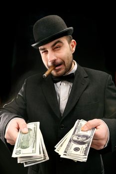 Portrait of man in suit with dollar bills 