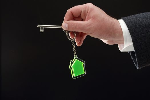 key and transparent key chain in the shape of House