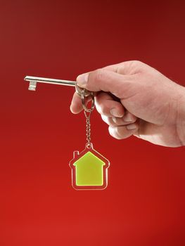 key and transparent key chain in the shape of House