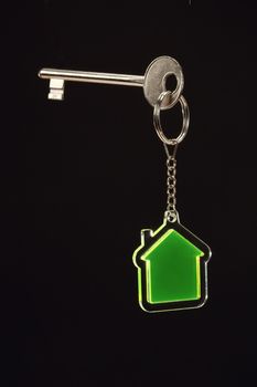key and transparent key chain in the shape of House