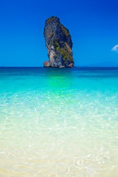 Poda Island surrounded by blue skies and crystal clear water