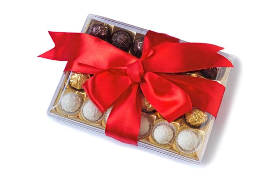 Box of delicious chocolates, nicely decorated and tied with a ribbon gift for any holiday or celebration. Presented on a white background