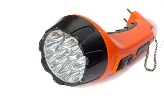 Comfortable small battery electric torch orange. Presented on a white background.