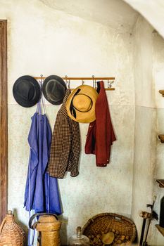 Rural cloakroom at a farm with antique clothes