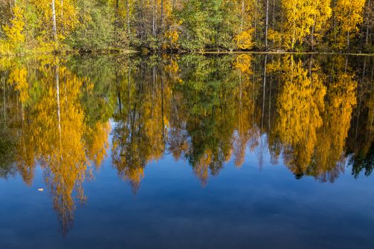Autumn lake view with a beautiful reflections
