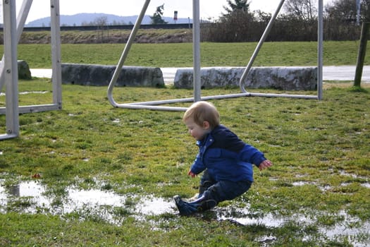 Boy slips in puddle