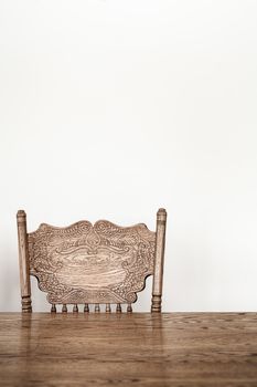 Wooden Dining room table and chair details and blank wall for your text, image or logo.