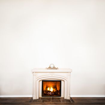 Luxurious White Marble Fireplace and empty wall for your text, logo, images, etc