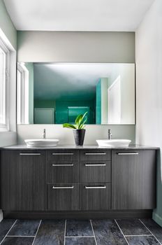 Modern Bathroom with big mirror. Soft Green Pastel Colors