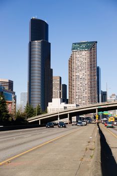 Vehicles travel down Interstate 5 infron of Seattle Downtown