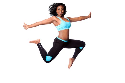 Beautiful happy energetic woman doing freedom sports jum with arms open, isolated.