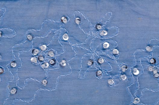 Blue cotton fabric embroidered with shiny beads