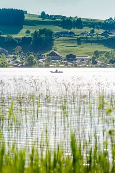 Boat driver in a lake taken in salzkammergut, austria